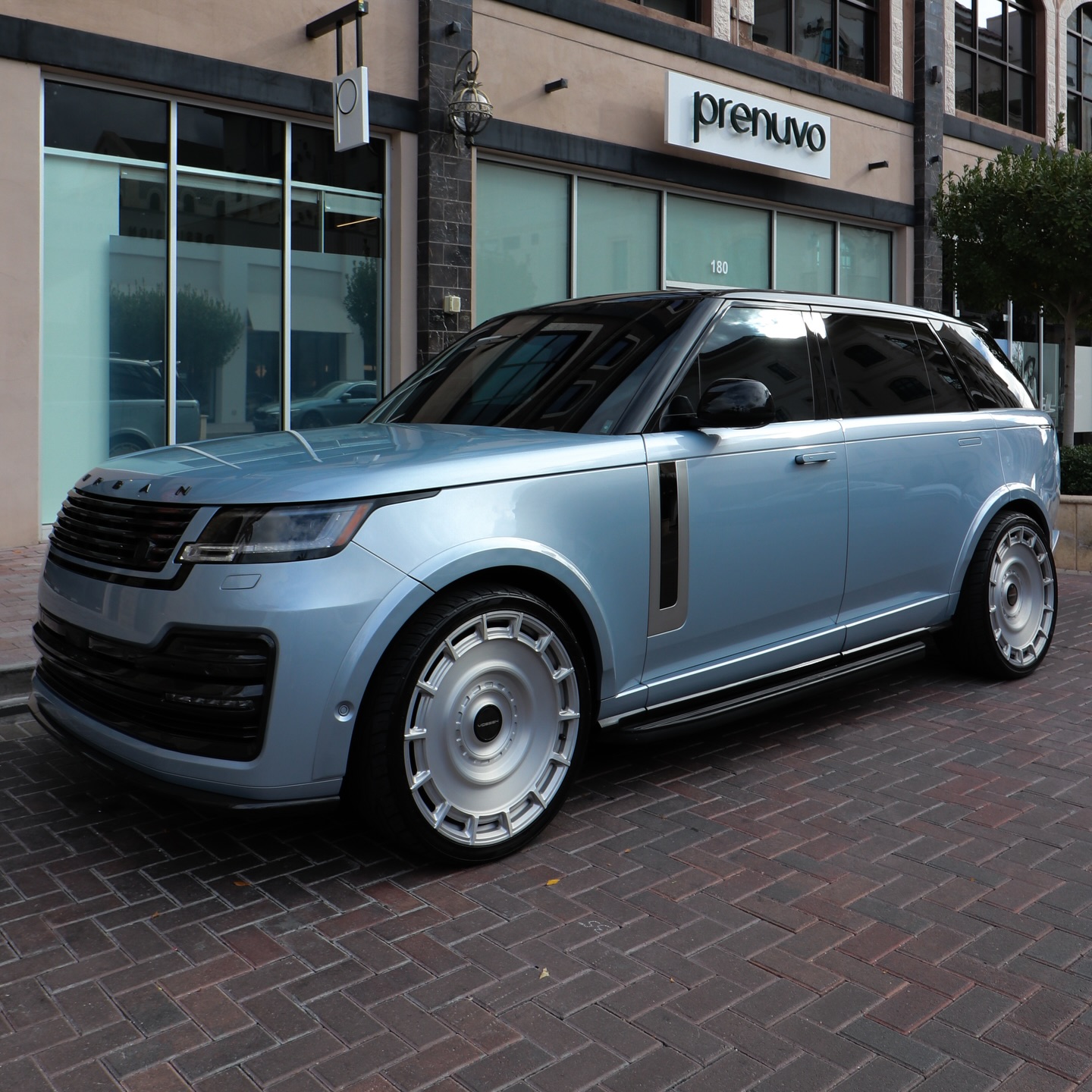 Light blue Range Rover on silver Vossen forged wheels built at Lusso Auto Design