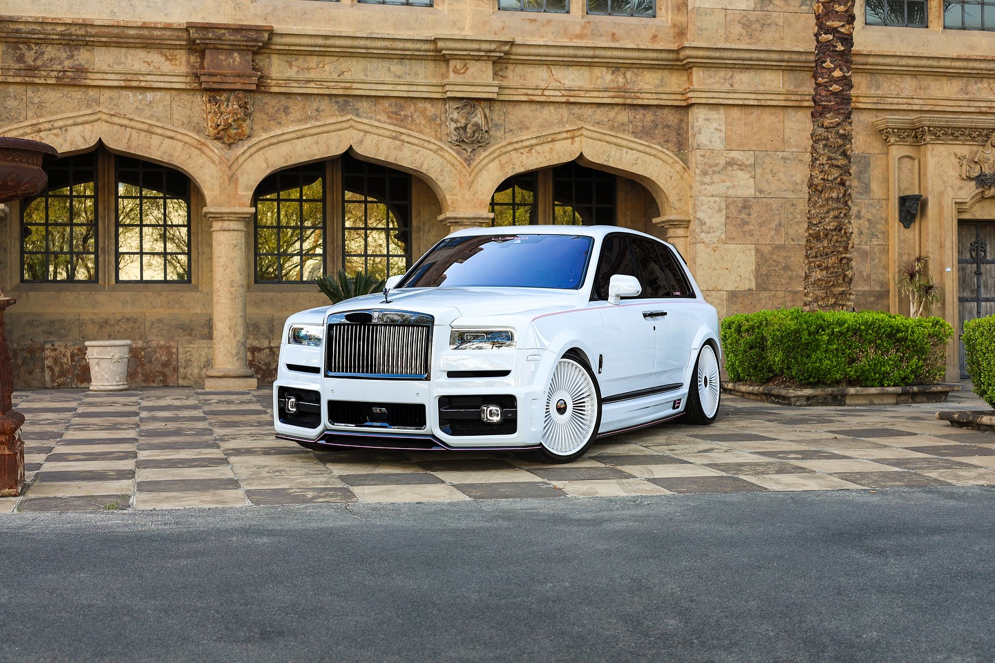 White Rolls-Royce Cullinan with a full widebody kit and forged wheels
