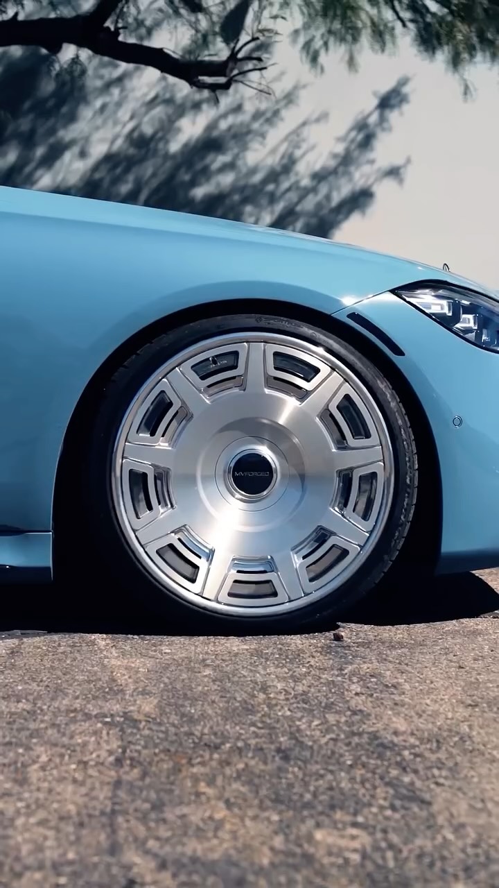 MV Forged turbine wheel on a lowered light blue Mercedes