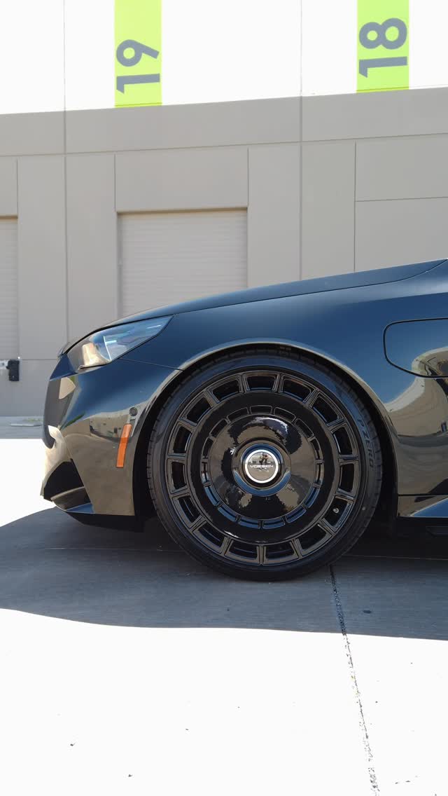 Black BMW on gloss wheels with ceramic coated paint