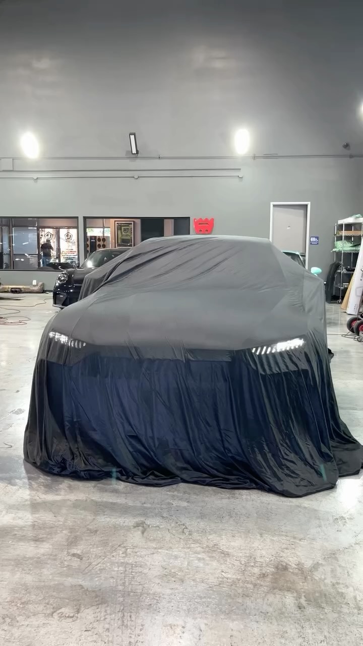 Audi RS7 covered in the Lusso shop before the matte black PPF wrap reveal