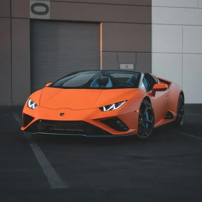 Lamborghini finished in an orange color change wrap at Lusso Auto Design