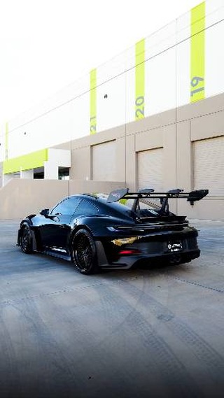 Dark Porsche 911 GT3 RS with full aero wing after ceramic coating at Lusso Auto Design