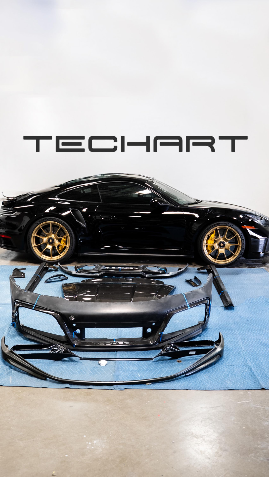 TechArt carbon body kit laid out before install on a Porsche 911 Turbo S