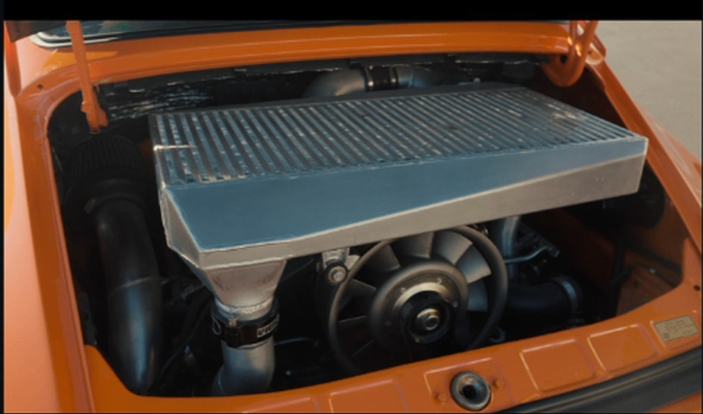Turbocraft long-neck intercooler installed in the engine bay of the 930