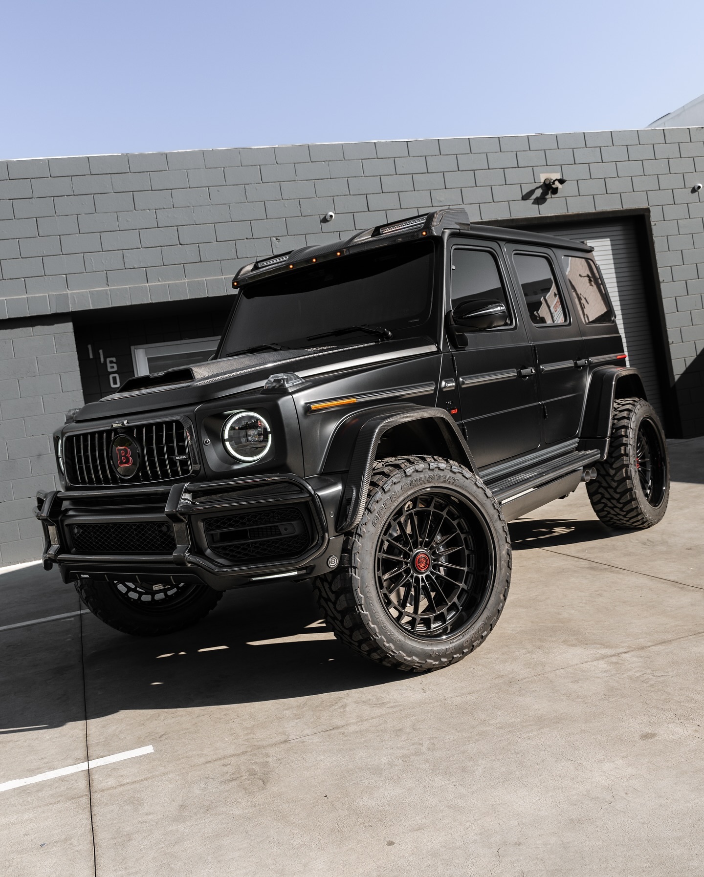 Blue Mercedes-AMG G63 with a body kit conversion by Lusso Auto Design