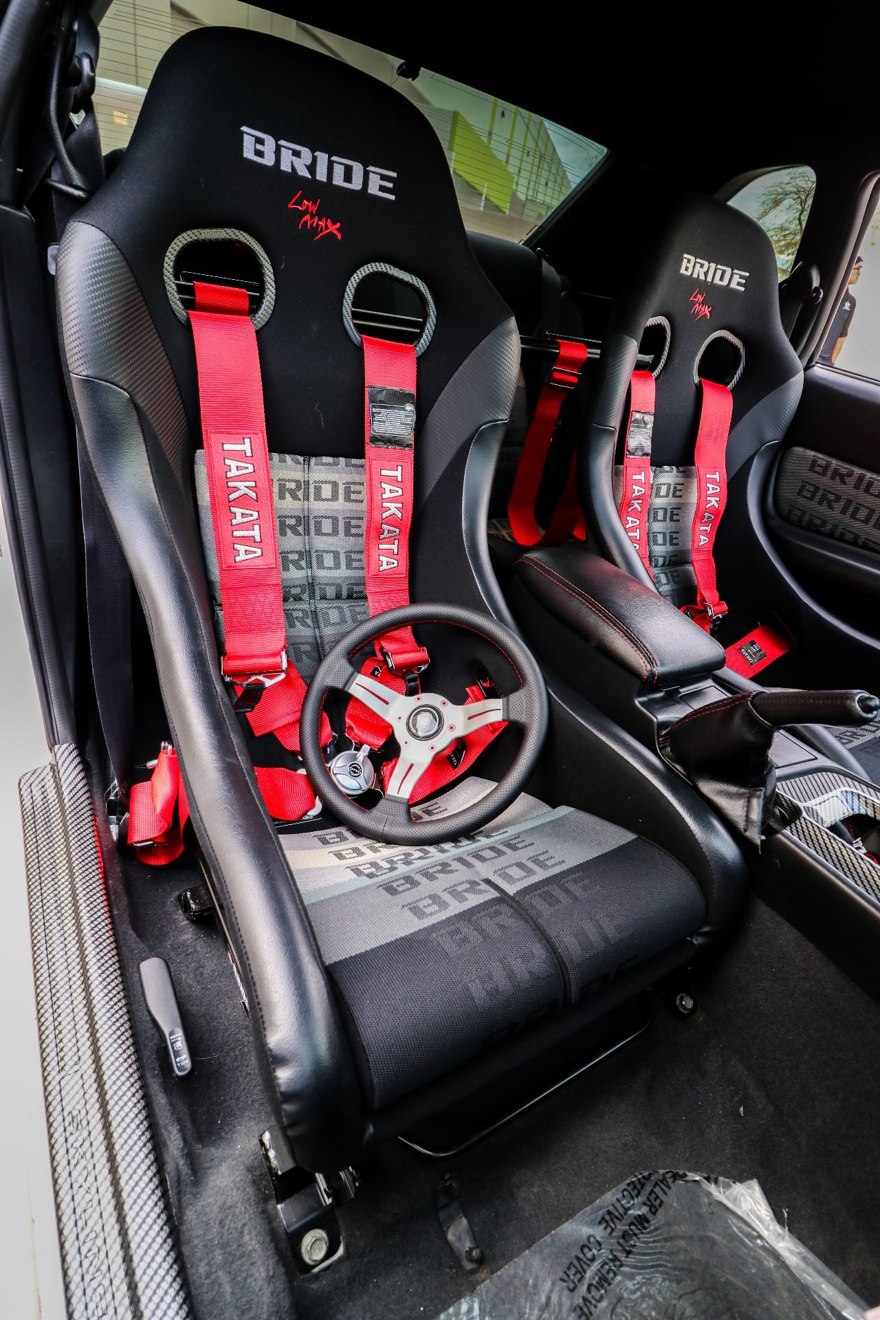 Fixed-back bucket seats installed in a custom Lusso interior build