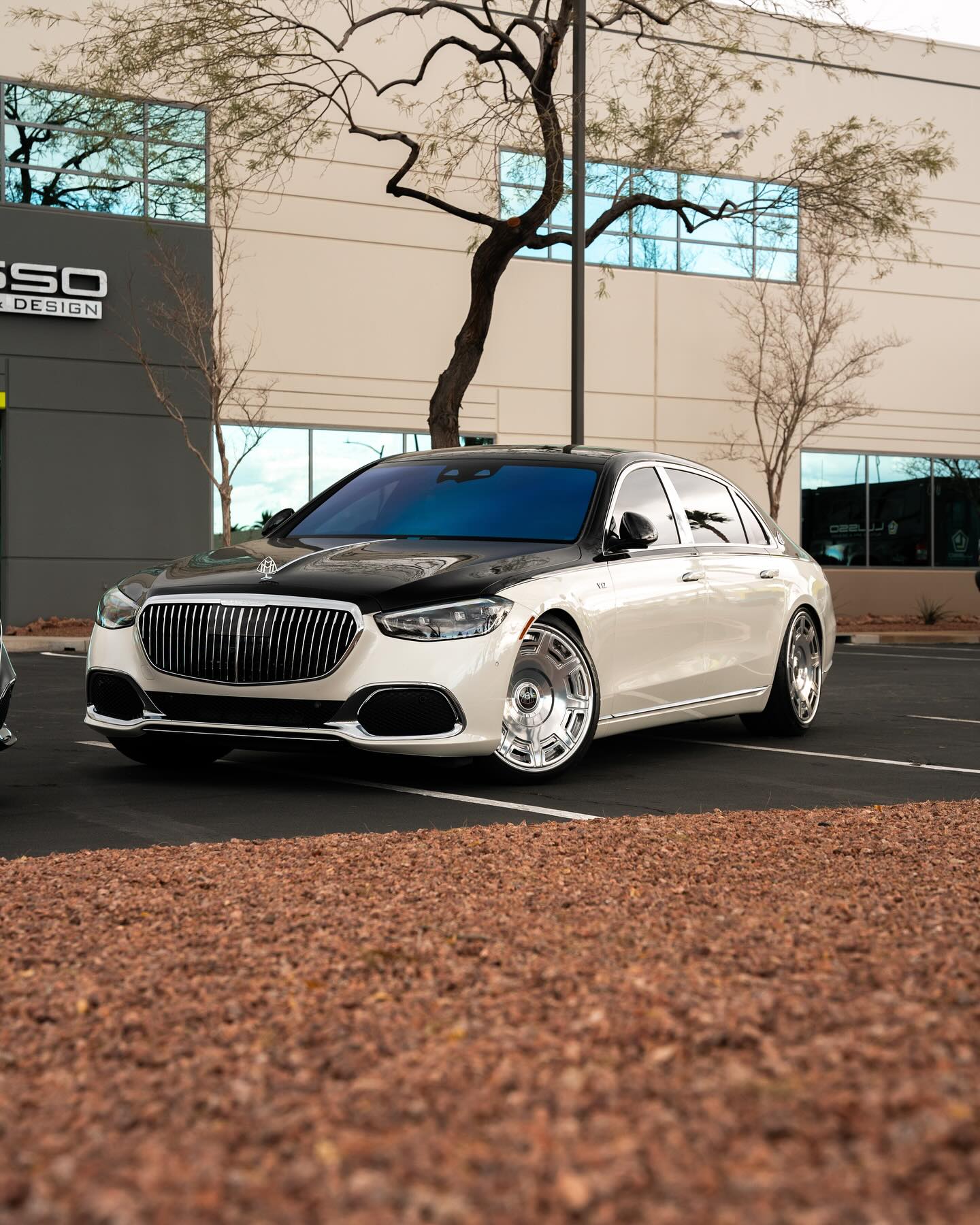 White Mercedes-Maybach inside the Lusso Auto Design detail bay in Henderson